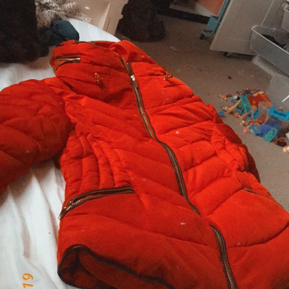A red puffer jacket